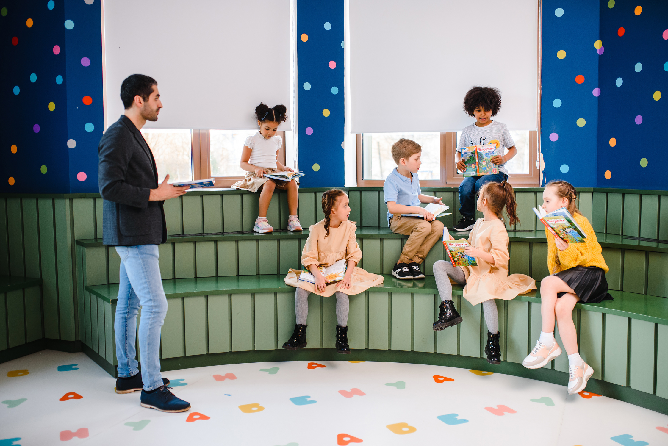 Children and Man Reading Books Together