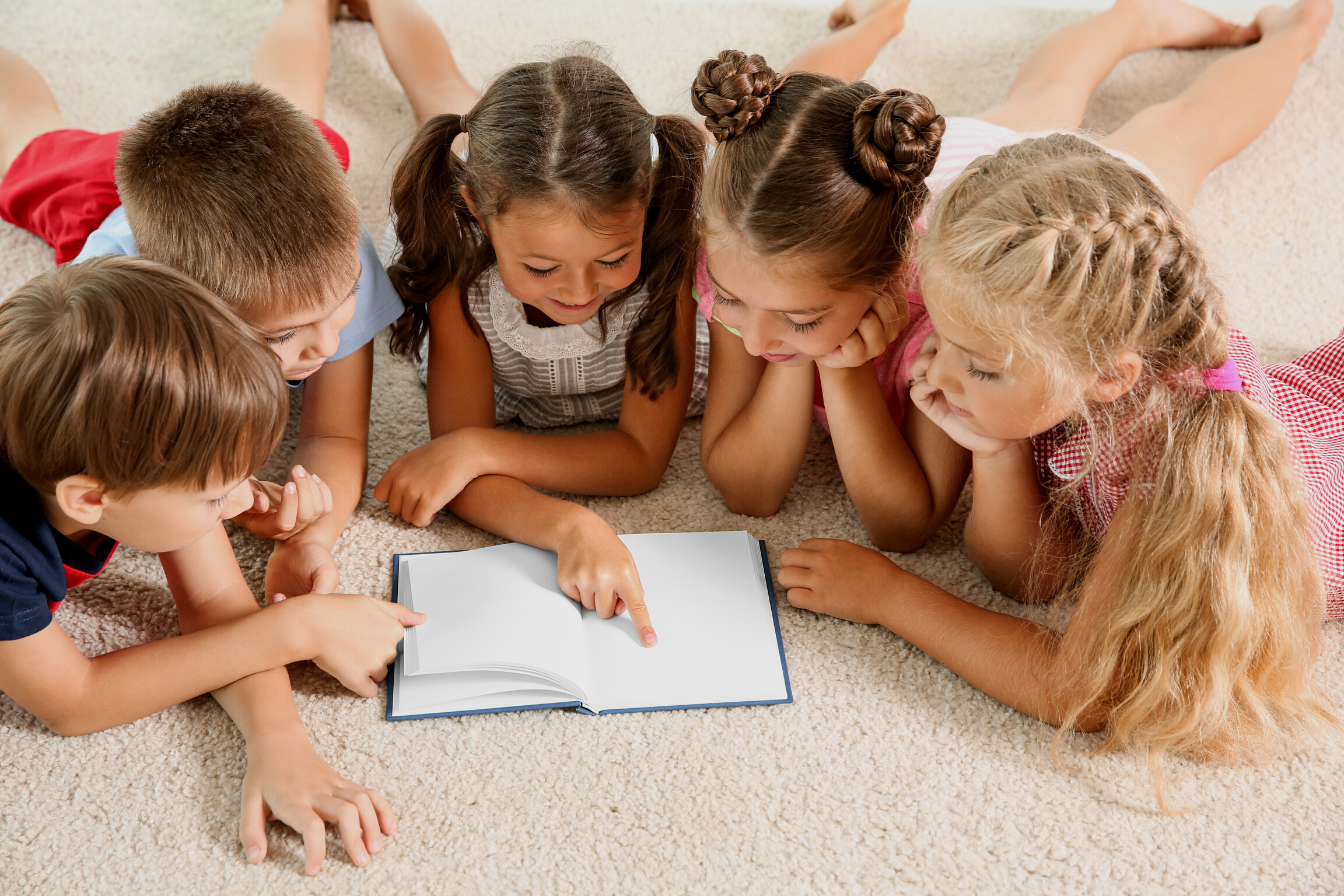 Cute Little Children Reading Book Indoors