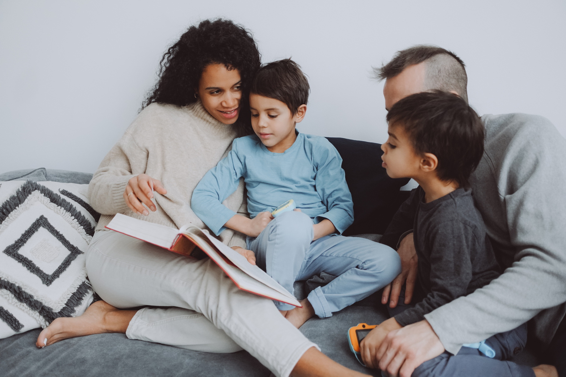 Mother Reading a Book to Her Kids